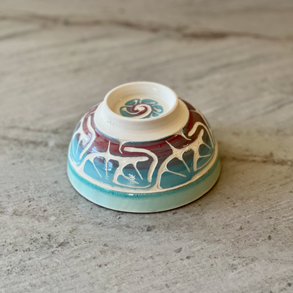 Porcelain Bowl with Floral Red and Blue Slip Carving