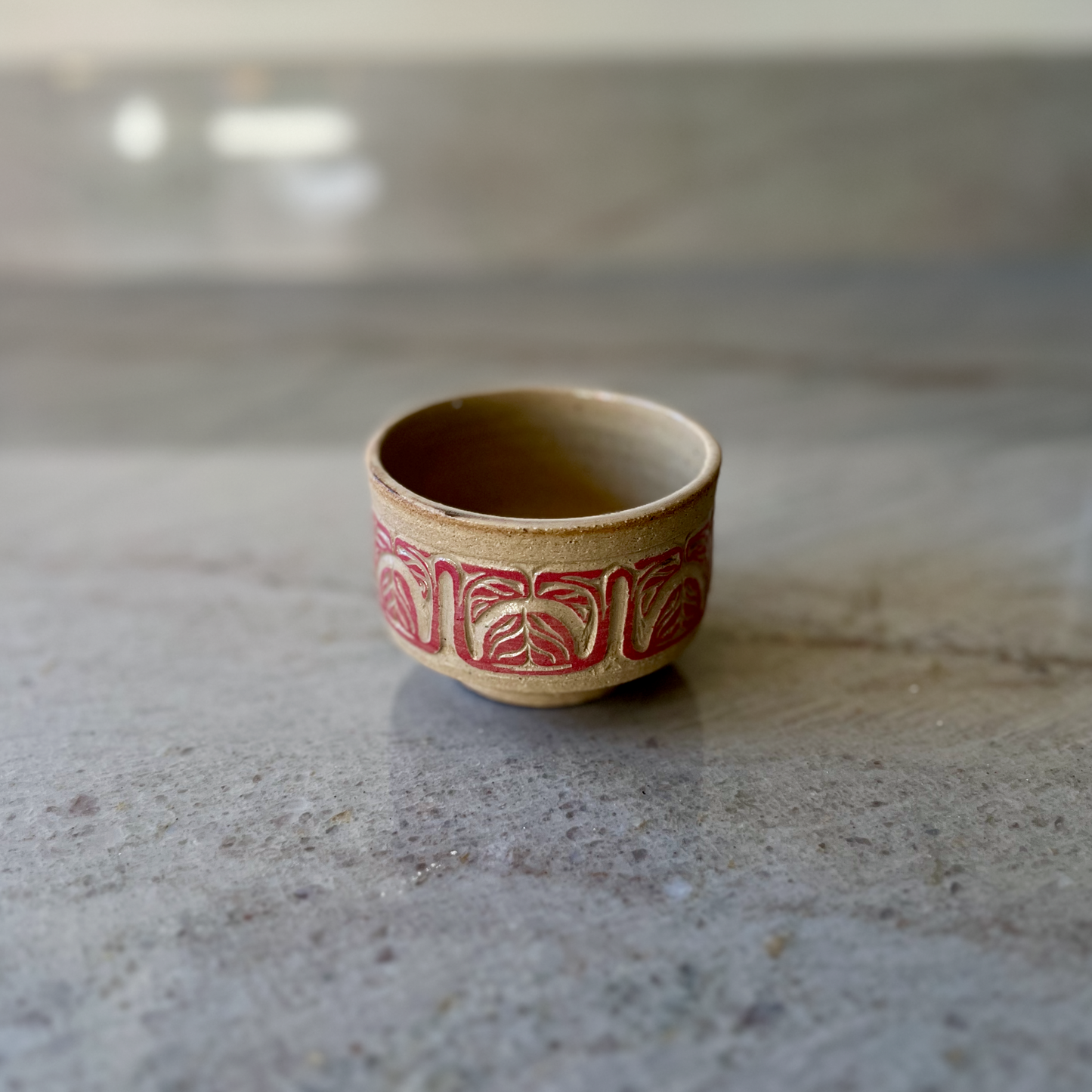 Sandy Clay Teacup with Red Carving 2